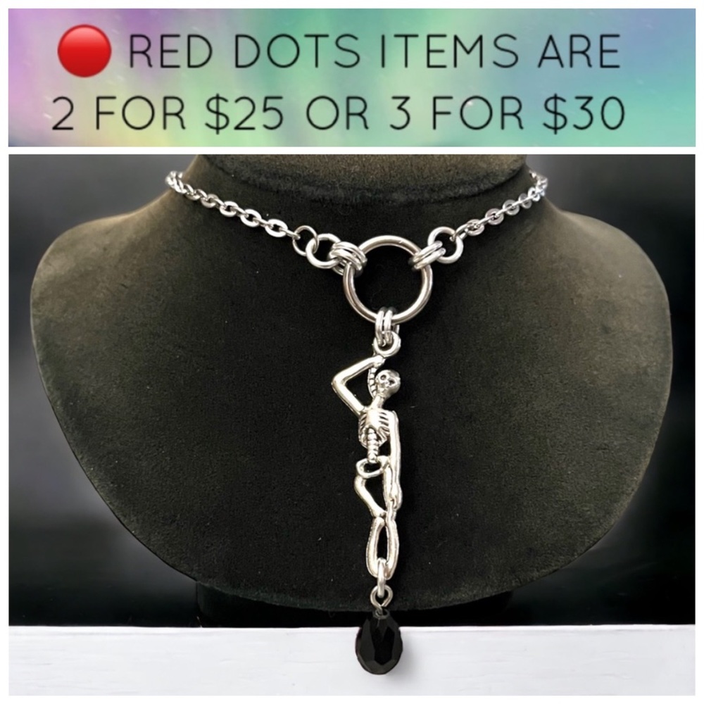 🔴 stainless steel chain & skeleton charm with dangly black stone .